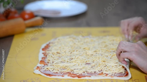 Cooking homemade Italian pizza roll on the wood table and chef photo