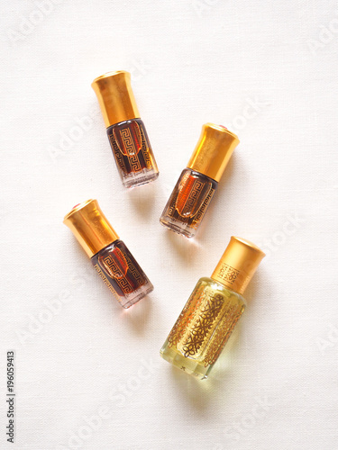 Arabian oud attar perfume or agarwood oil fragrances in mini bottles.

