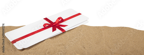 Air tickets as a gift with a red ribbon and bow. Isolated on white background