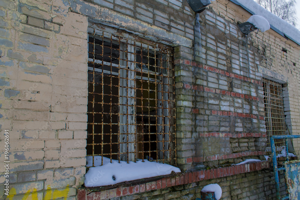 The ruins of the city, an abandoned military base, brick walls, bars on the Windows