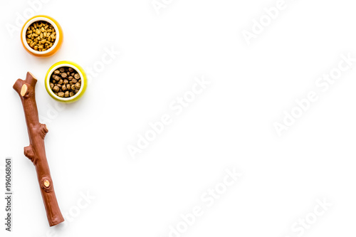 toys for pets, brushes and dry food on white background top view space for text photo