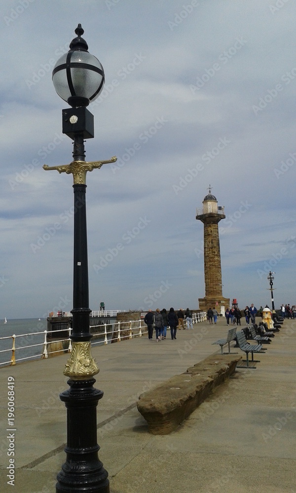 Harbour and lighthouse in Whitby, England