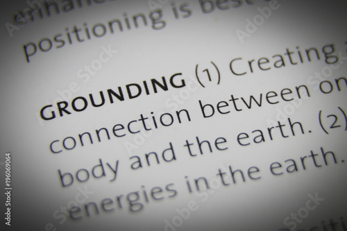 The word Grounding close up on paper photo