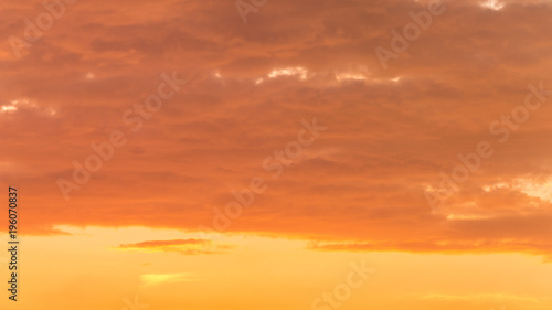 Fiery orange very beautiful sunset sky. Dramatic clouds after rain © LALSSTOCK