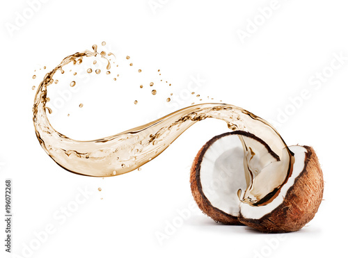 Coconut with splashes of juice close-up, isolated on white background