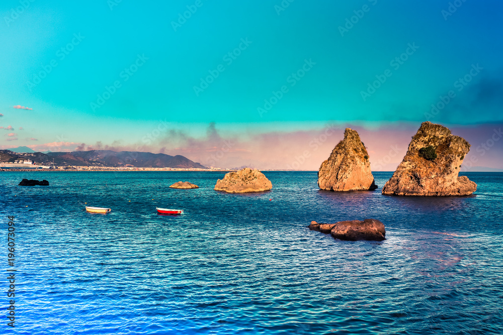 Vietri sul Mare - where Amalfi coast begins. Picturesque summer seascape with 3 rocks on water and mountains. Italy