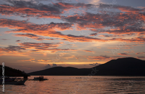 Sunset and fishing boats over Mochima National Park, Sucre, Venezuel photo
