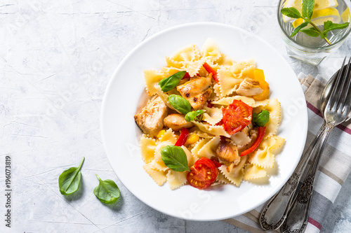 Pasta with chicken and vegetables top view.