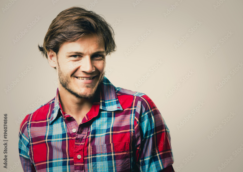 caucasian man wearing checkered shirt and trendy hairstyle caucasian man wearing checkered shirt and trendy hairstyle