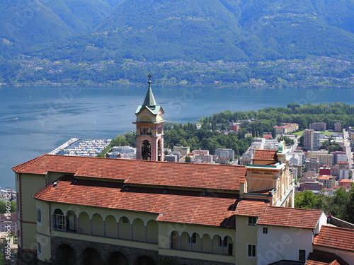 Madonna del Sasso Church above Locarno swiss city and alpine Maggiore lake at canton Ticino in Switzerland photo