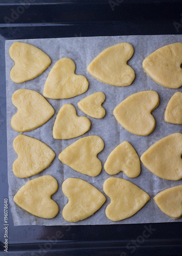 The process of of preparing gingerbread hearts on Valentine's Day. top view