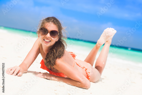 long haired woman in swimsuit at beach.Maldives