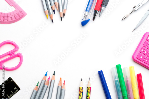 Back to school. Colorful school stationery framing isolated on white background - copyspace top view