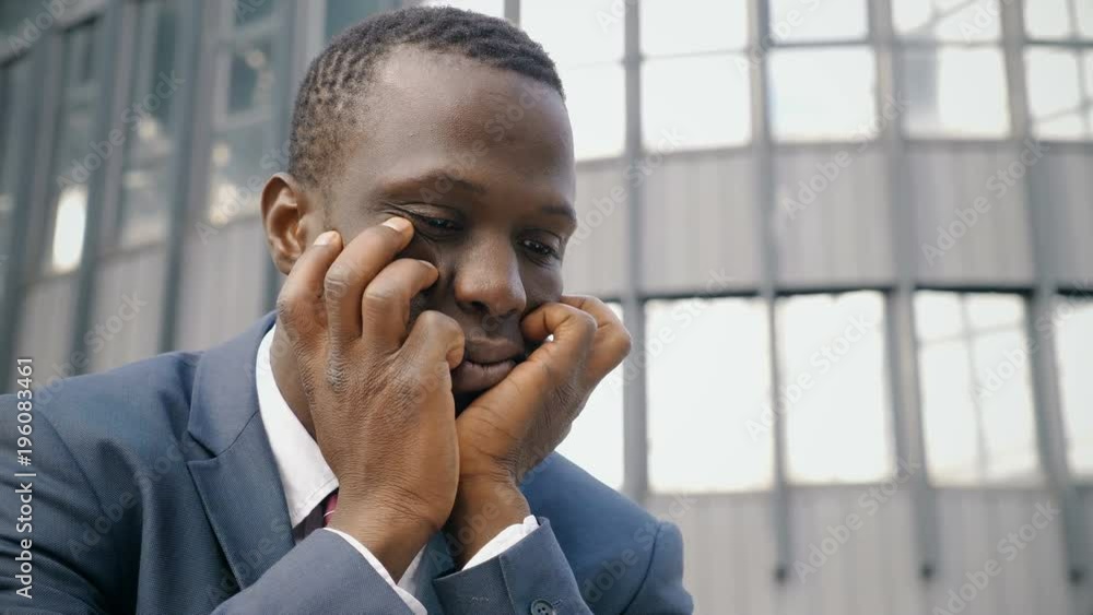 sad and worried african american business man- outdoor sad and worried african american business man- outdoor