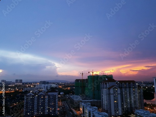Colorful dramatic pastel evening sky over cityscape of Johor Bahru, Malaysia