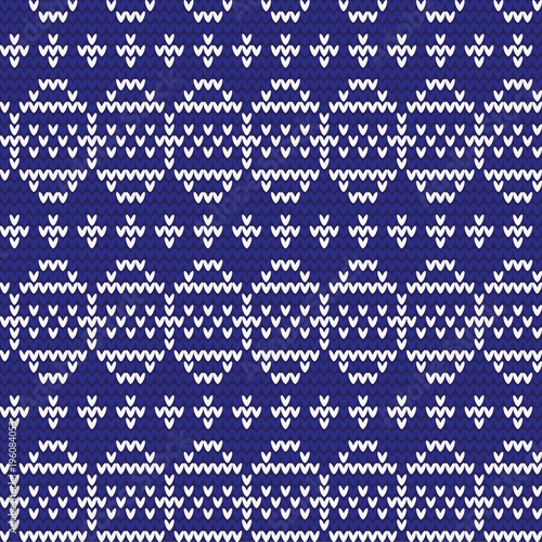 Knitted pattern of Easter eggs white on a blue background. Happy easter Greeting Card. Easter eggs on knitting pattern