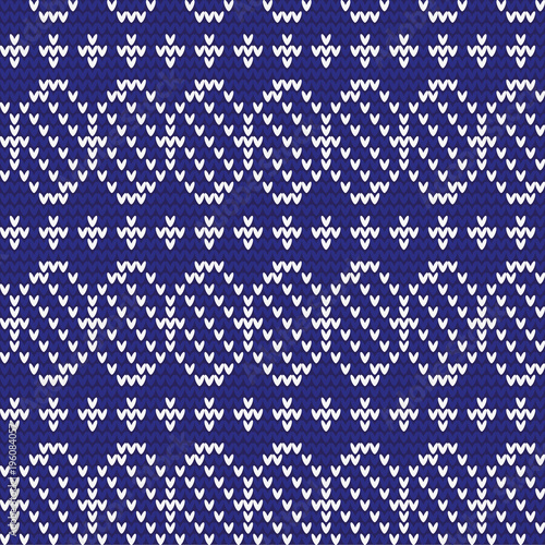 Knitted pattern of Easter eggs white on a blue background. Happy easter Greeting Card. Easter eggs on knitting pattern