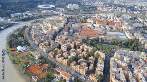 Aerial view of the Tiber in the northern part of Rome, Italy. In the background you can see the Olympic stadium and the italic forum. At the bottom of the red clay tennis courts.