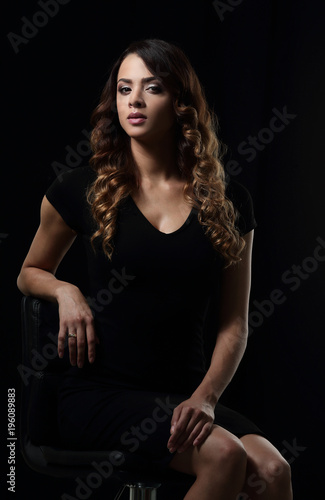 young gorgeous caucasian brunette in dress on chair © ASDF