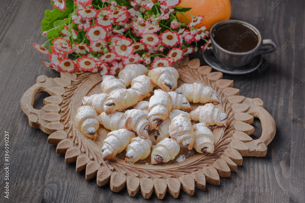 mini croissants on a wooden table,Bagels with a cup of coffee on a wooden table,bagels on a wooden table. mini croissants on a wooden table,Bagels with a cup of coffee on a wooden table,bagels on a wooden table.