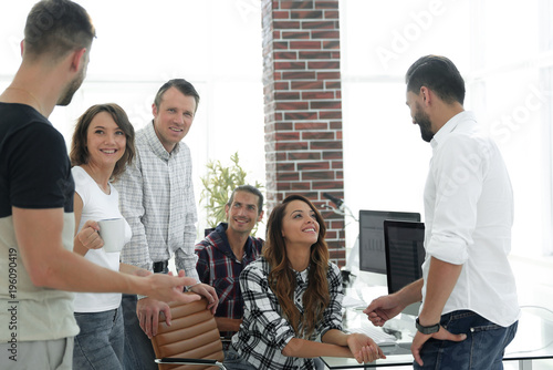 team of young employees discussing