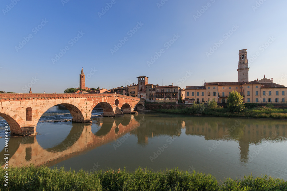 Verona cityscape with Ponte Pietra on Adige river with historical buildings