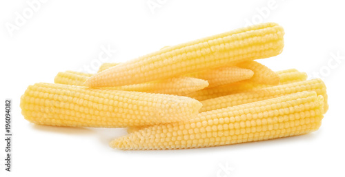 Heap of fresh young baby corn on white background