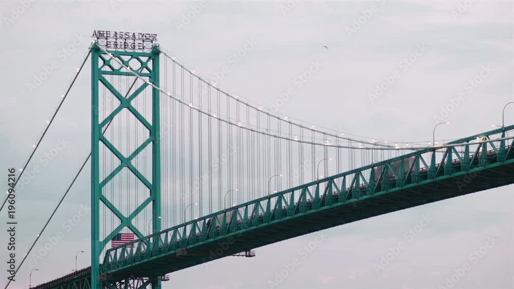 Ambassador Bridge in Detroit Michigan with Trucks Passing Between the USA and Canada Ambassador Bridge in Detroit Michigan with Trucks Passing Between the USA and Canada