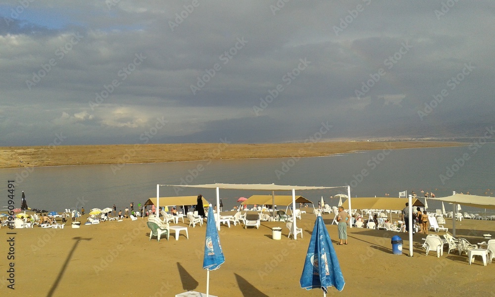 Watching a storm role in from the Palestinian beach on the Dead Sea Watching a storm role in from the Palestinian beach on the Dead Sea