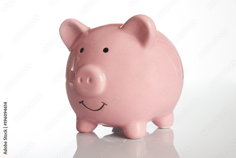 Ceramic Pink piggy bank isolated on white background with copy space, side view close-up