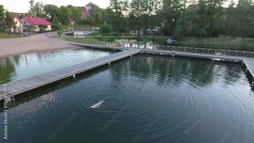 Low Over Woman Swimming in Polish Lake Low Over Woman Swimming in Polish Lake