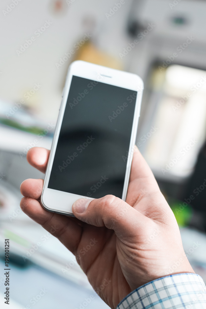 Businessman using mobile phone on light background for photo or video. Writing text, checking calls, reading messages. Close up picture of communication technology device Businessman using mobile phone on light background for photo or video. Writing text, checking calls, reading messages. Close up picture of communication technology device