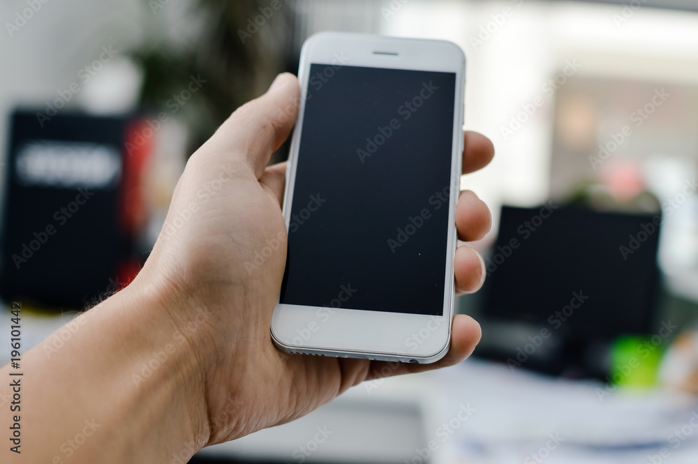 Businessman using mobile phone on light background for photo or video. Writing text, checking calls, reading messages. Close up picture of communication technology device Businessman using mobile phone on light background for photo or video. Writing text, checking calls, reading messages. Close up picture of communication technology device