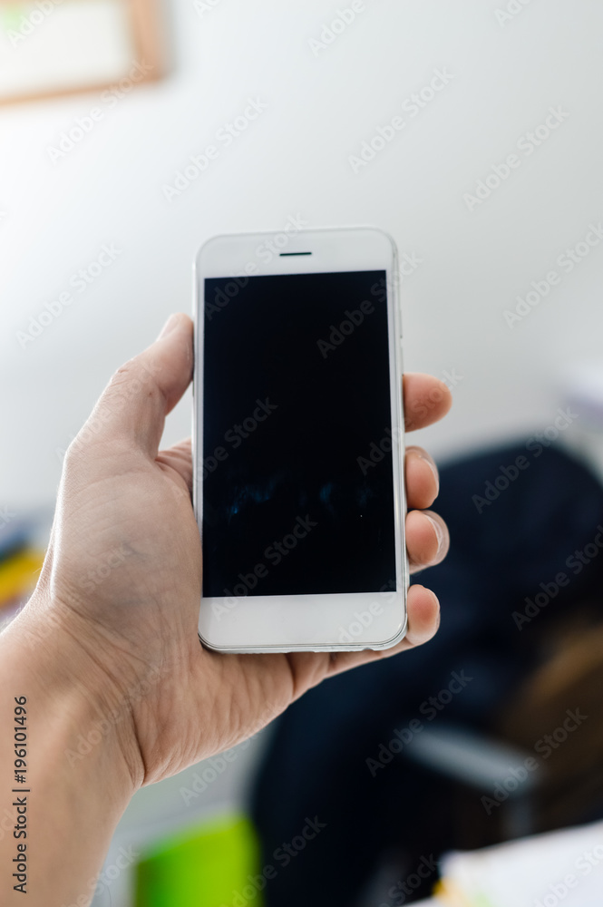 Businessman use mobile phone on light background for photo or video. Writing text, checking calls, reading messages. Close up picture of communication technology device Businessman use mobile phone on light background for photo or video. Writing text, checking calls, reading messages. Close up picture of communication technology device