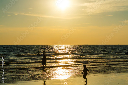 Sandy beach, golden sea, sunset