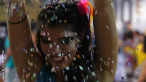 Woman Dancing and Celebrating with Confetti at Brazilian Carnival, Salvador, Bahia