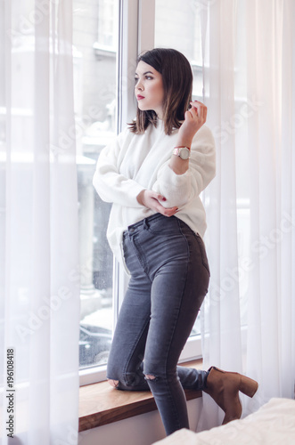 Free Download Young pretty woman standing and looking outside enjoys of rest - GFXLoad