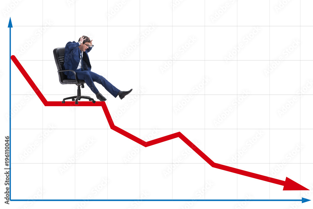 Businessman sliding down on chair in economic crisis concept Businessman sliding down on chair in economic crisis concept