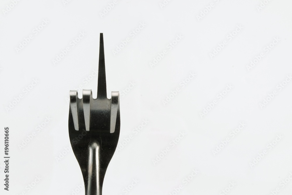 Folding fork as a symbol of Digitus infamis (Fuck You) isolated on white background. Folding fork as a symbol of Digitus infamis (Fuck You) isolated on white background.