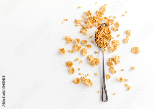 Healthy Corn Flakes with milk for Breakfast on table photo