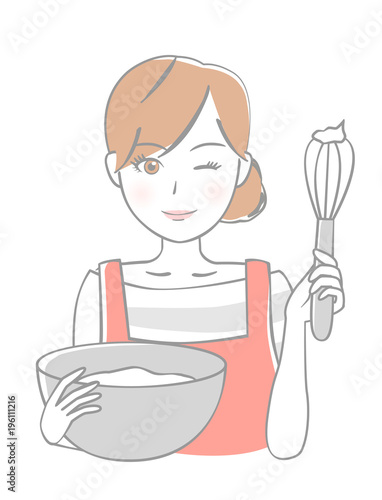 泡立て器を持つ女性