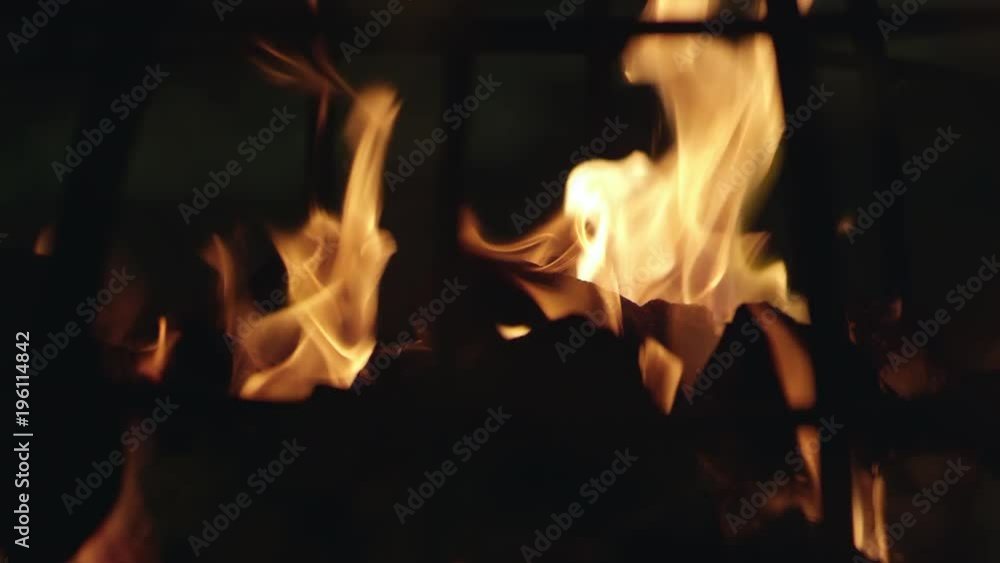 Up close view of flames from fire pit burning in outdoor shopping area. Up close view of flames from fire pit burning in outdoor shopping area.