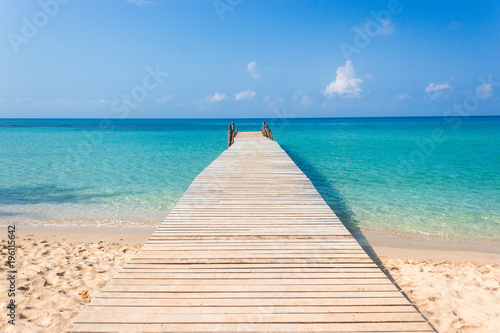 Wooden bridge on the tropical beach and blue sky © kaisorn