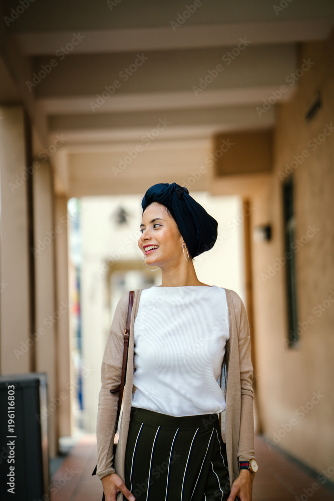 Portrait of a young Muslim woman wearing a hijab. She is standing in the midlle of the hallway and wearing an elegant, attractive and professionally dressed. Portrait of a young Muslim woman wearing a hijab. She is standing in the midlle of the hallway and wearing an elegant, attractive and professionally dressed.