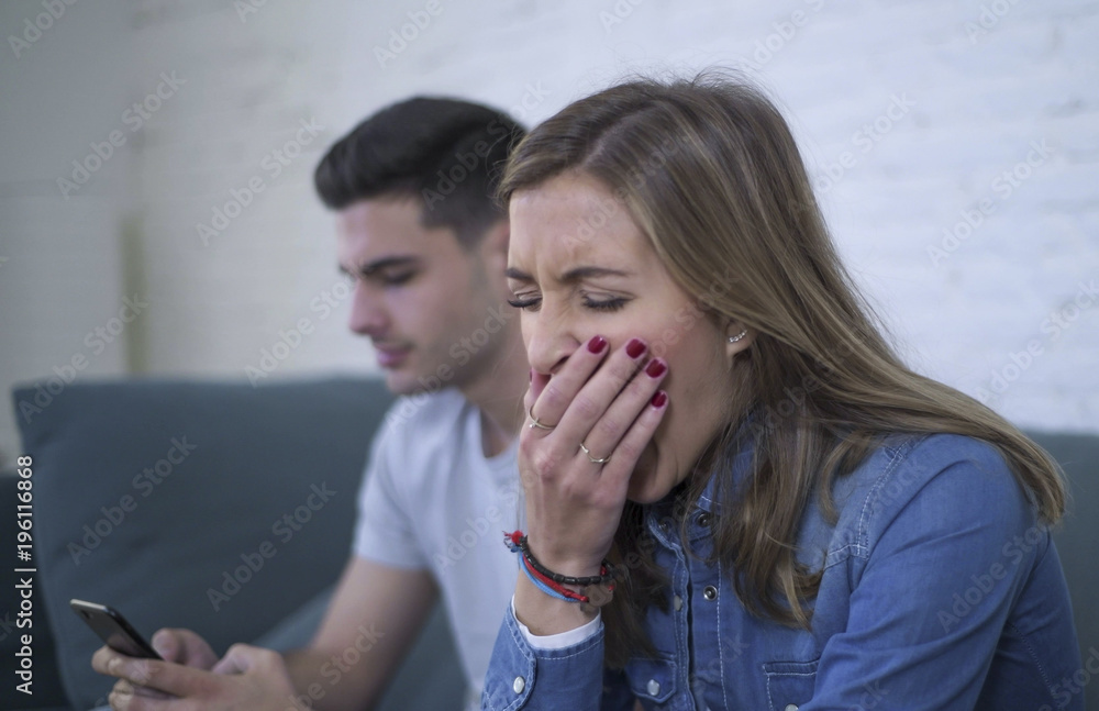 young attractive couple in relationship problem with internet mobile phone addiction boyfriend ignoring sad neglected and bored girlfriend young attractive couple in relationship problem with internet mobile phone addiction boyfriend ignoring sad neglected and bored girlfriend