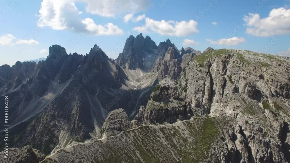 AERIAL VIEW: flight over Dolomiti , Italian National Park Tre Cime Di Lavaredo camera moving forvards .