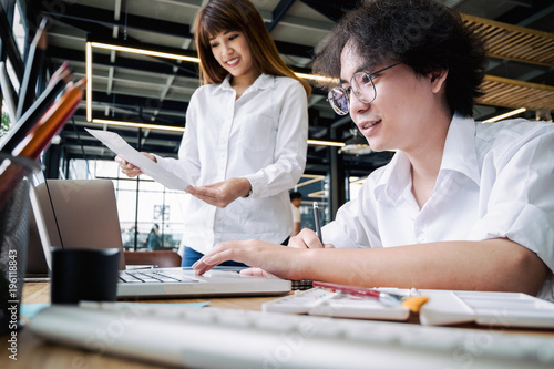 designer graphic brainstorming together with tablet and laptop designing design project, designer graphic concept