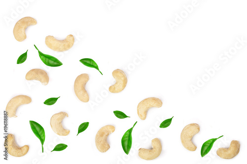 cashew nuts with leaves isolated on white background with copy space for your text. top view. Flat lay pattern