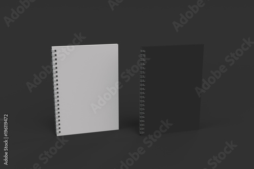 Two notebooks with spiral bound on black background