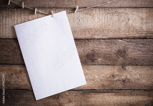 white paper on wooden background photo